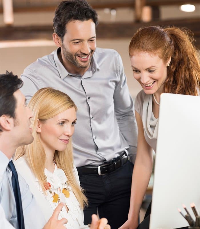 TNS Consulting team reviewing a training schedule together